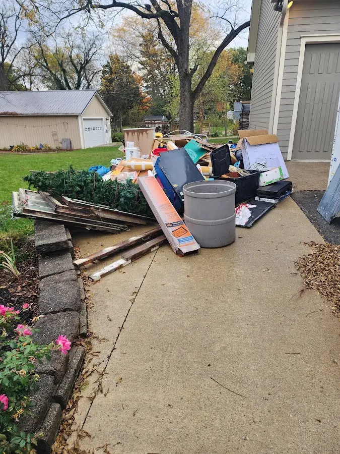 Dumpster being loaded with debris for Demolition Dumpster Rental in Gleed